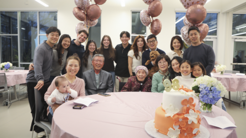 Family members and 이옥순 posing for her birthday party