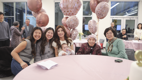 Family members and 이옥순 posing for her birthday party